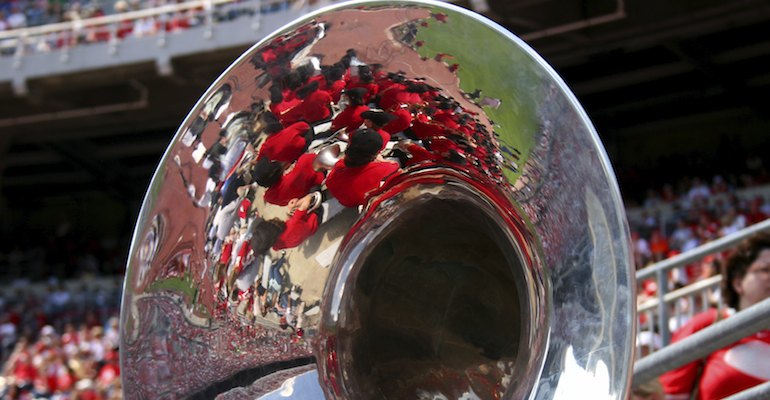 A tuba at a football game where some participants are talking about Ohio adoption laws