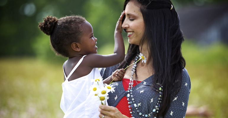 A mother preparing her adopted daughter for questions about racial differences