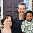 A family sitting together happily after accepting an adoption referral