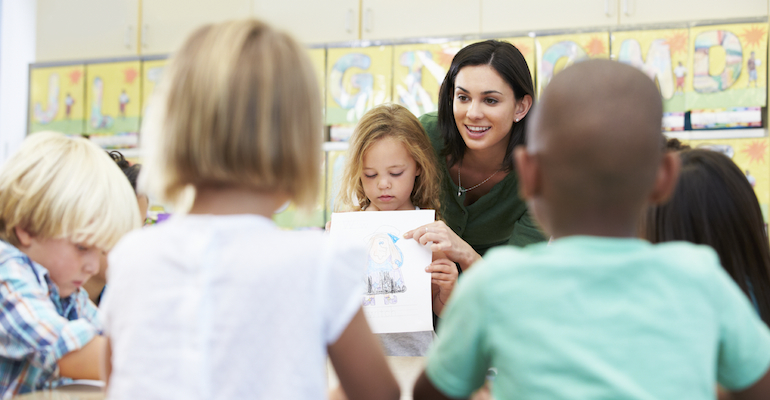 A child presenting one of her adoption-related school assignments