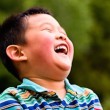 A laughing child who joined his family through Taiwan adoption