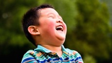 A laughing child who joined his family through Taiwan adoption