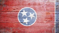 A wood painted flag of Tennessee, representing the state where Tennessee adoption laws apply