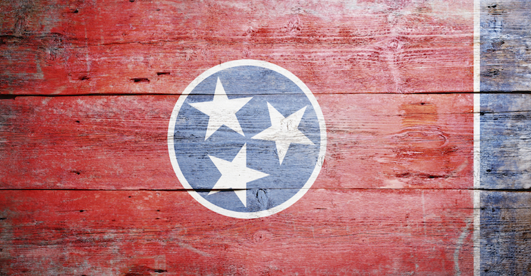A wood painted flag of Tennessee, representing the state where Tennessee adoption laws apply