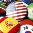 Collection of flag buttons, representing intercountry adoption