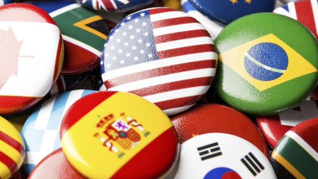 Collection of flag buttons, representing intercountry adoption