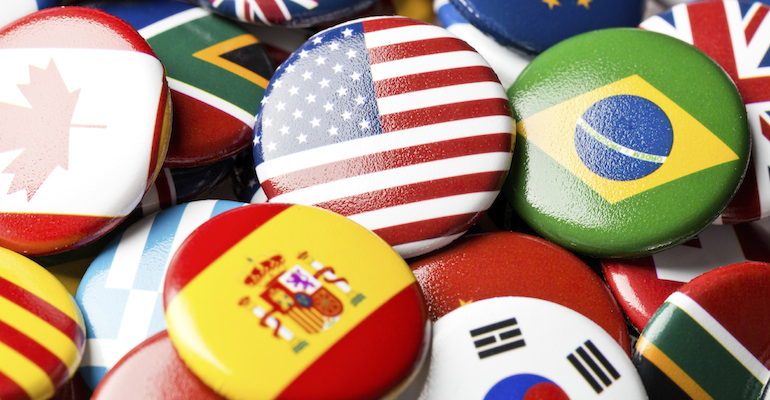 Collection of flag buttons, representing intercountry adoption