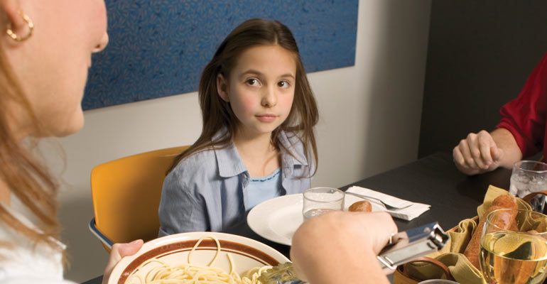 An adoptee imagining life in a different family, watching another mother serve spaghetti