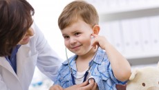 A child getting a doctor's exam, covered by health insurance