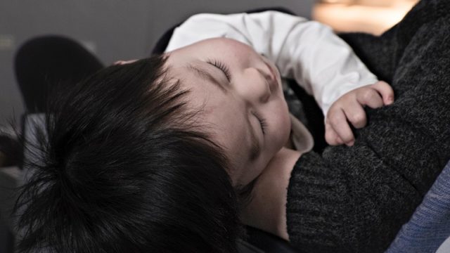 A mom holds her baby daughter