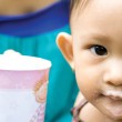 One parent supplements her child's diet after adopting a malnourished child.