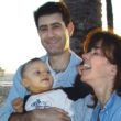 I.D. Steinberg and her husband pose with the son that made them first time parents