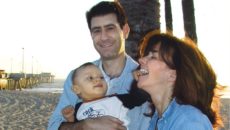 I.D. Steinberg and her husband pose with the son that made them first time parents