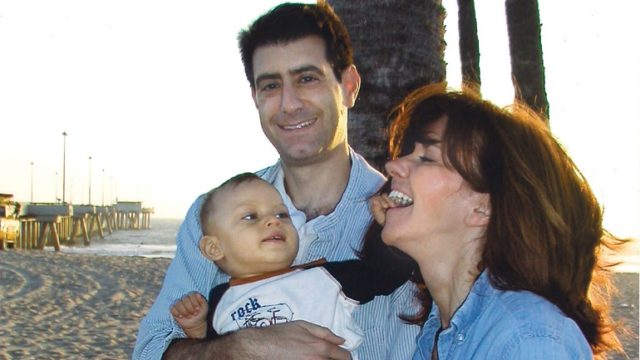 I.D. Steinberg and her husband pose with the son that made them first time parents