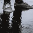 A pair of sneakers on a rainy day