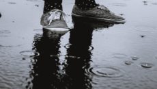 A pair of sneakers on a rainy day