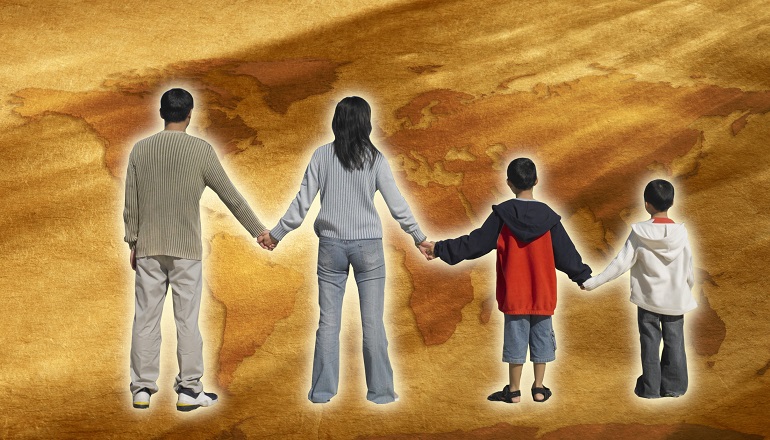 A family looks at a map, symbolism for taking a heritage tour.