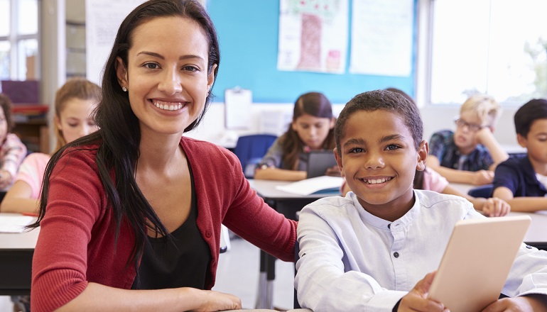 Portrait of a teacher and student who have discussed his adoption story.