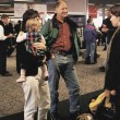 A family in an open adoption waits for the arrival of the birth mother