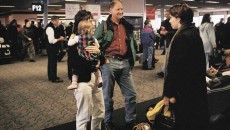 A family in an open adoption waits for the arrival of the birth mother