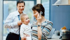 A family in an open adoption talks to birth parents on the phone