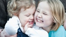 Young girls playing with their birth father.