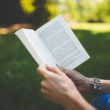 A woman reading adoption books for parents