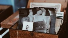 A box of old photographs that show family resemblance