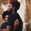 A girl embraces her birth mother after finding birth parents.