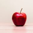 An apple on a teacher's desk who was explaining adoption.