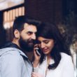 Two prospective adoptive parents listen to a phone call that they received a match.