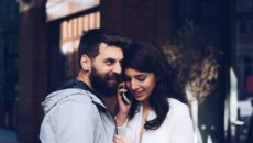 Two prospective adoptive parents listen to a phone call that they received a match.