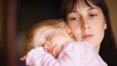 A woman holds her newly adopted baby.