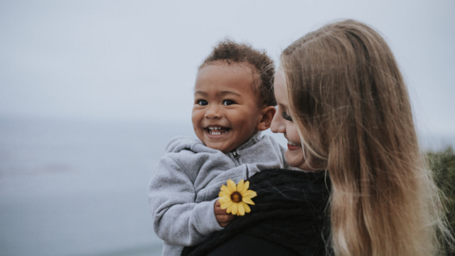 Happy mother and her son through foster adoption