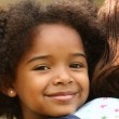 A young girl smiling to learn foster adoption facts