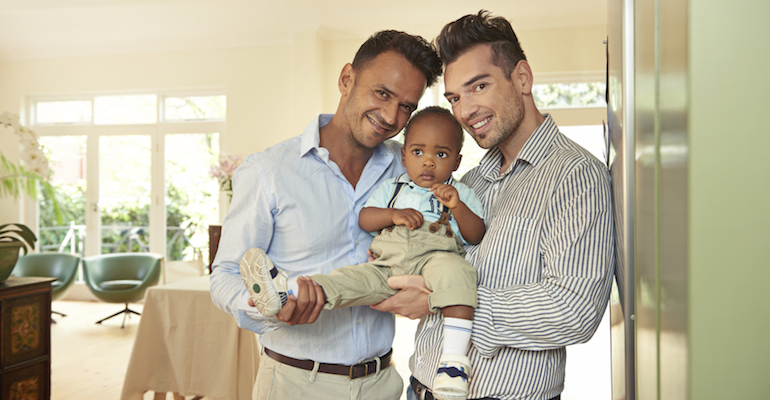 Parents like this happy gay couple talk about becoming a mom or dad after adoption