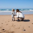 A mom of an adopted child, on the beach with that adopted child