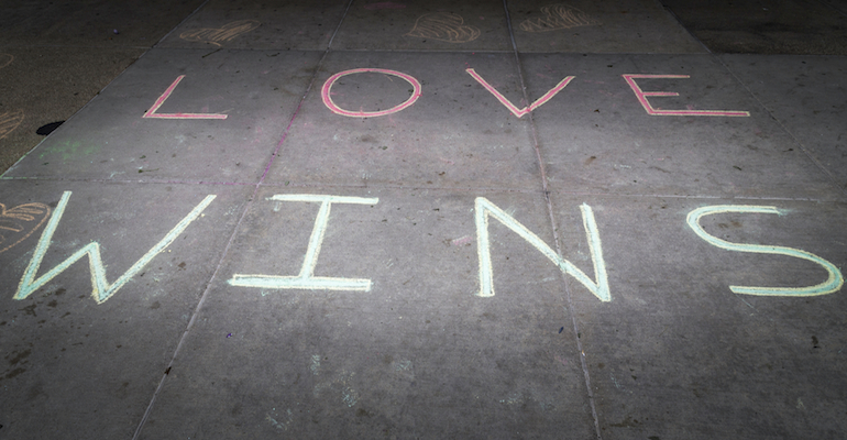 "Love wins" in chalk, representing the victories of LGBT marriage and same-sex adoptions