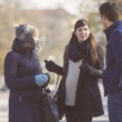 A couple meeting with a pregnant woman, hoping to have a positive expectant mother match