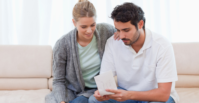 A couple choosing a referral for their adoption