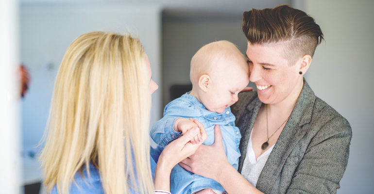 A happy family, formed through one of many same-sex adoptions