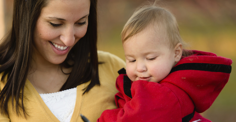 A mother and baby, discussing new state adoption laws