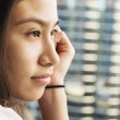 A young woman, thinking after reading Red Thread Sisters