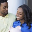 A happy couple finding financial support for adoption
