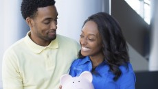A happy couple finding financial support for adoption