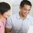 A family creating an adoption budget on their computer
