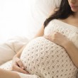 A pregnant woman, thinking about prenatal drug and alcohol use