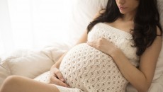 A pregnant woman, thinking about prenatal drug and alcohol use