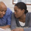 A couple discussing whether accepting a match is right for their family
