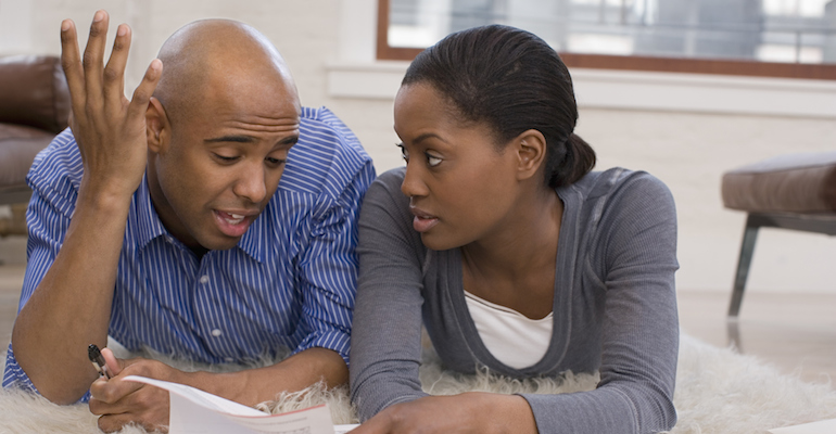 A couple discussing whether accepting a match is right for their family